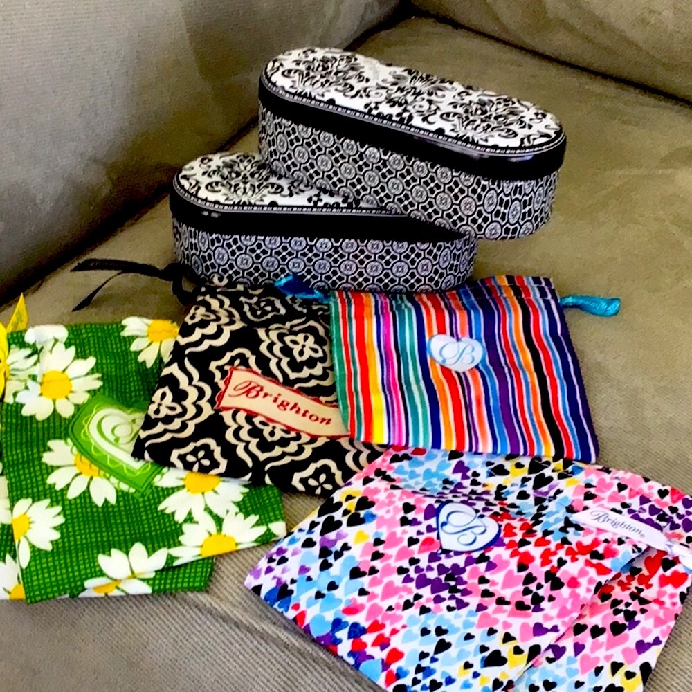 Brighton dust bags and glasses tin.